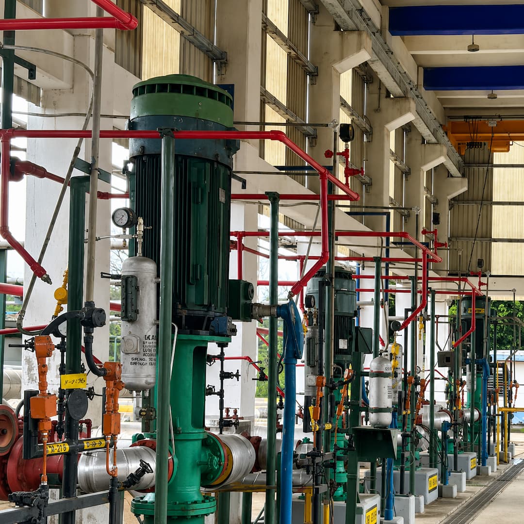 Industrial barrier seal fluid fill system featuring multiple pumps and piping, designed for efficient fluid management in a manufacturing facility.