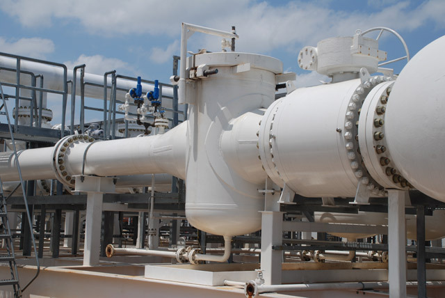 Industrial strainers installed in a processing facility, showcasing piping and filtration equipment designed for fluid management and contamination removal.