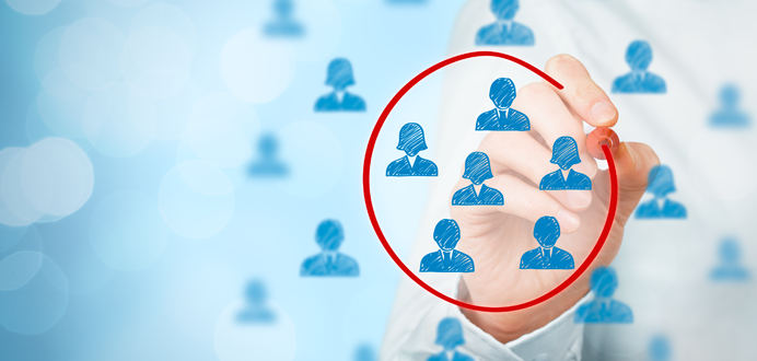 Hand drawing a red circle around a group of blue icons representing people, symbolizing the focus on specialized staffing solutions in the manufacturing industry.