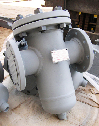 Basket strainer designed for loading rack applications, featuring a robust gray exterior, multiple bolt connections, and inlet/outlet ports for efficient fluid filtration.