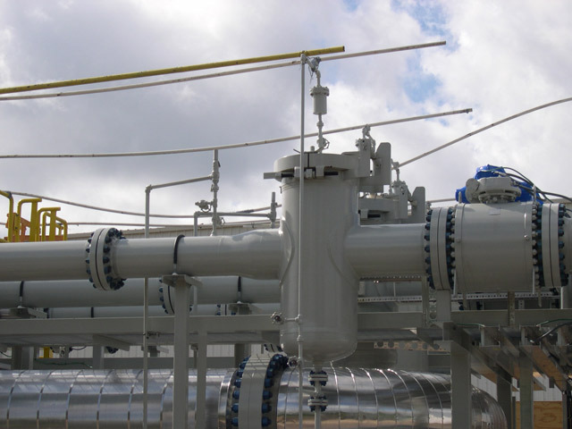 Industrial piping system featuring a meter protection basket strainer, designed for efficient filtration and protection against debris in fluid processes.