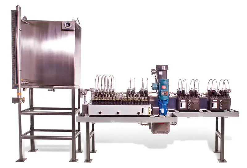 Ultra high pressure lubrication system featuring a stainless steel frame, high-capacity pump, and multiple pressure control valves, designed for efficient fluid processing in industrial applications.