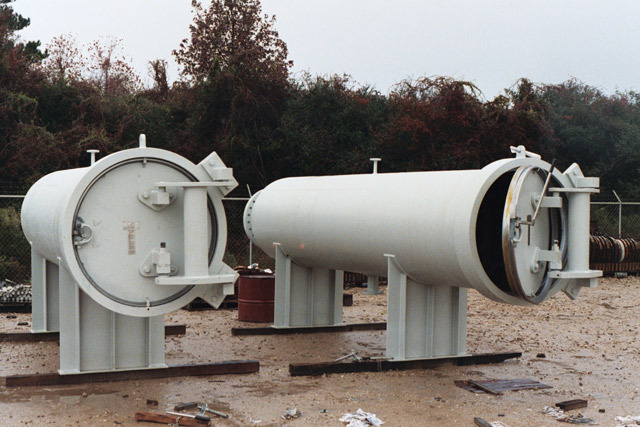 Horizontal basket strainers displayed outdoors, featuring two cylindrical strainers with protective coatings, designed for efficient liquid filtration in industrial applications.