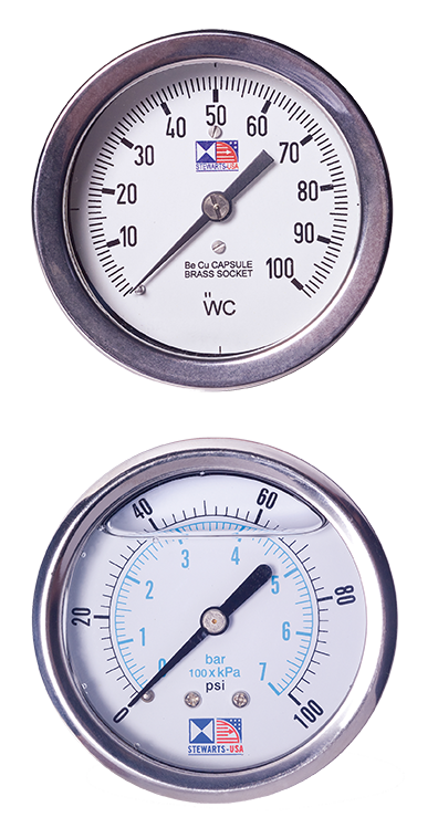Pressure gauges for lubrication systems, featuring a white dial with black and blue markings, indicating measurements in WC and psi/bar. Ideal for monitoring lubrication system performance and efficiency.