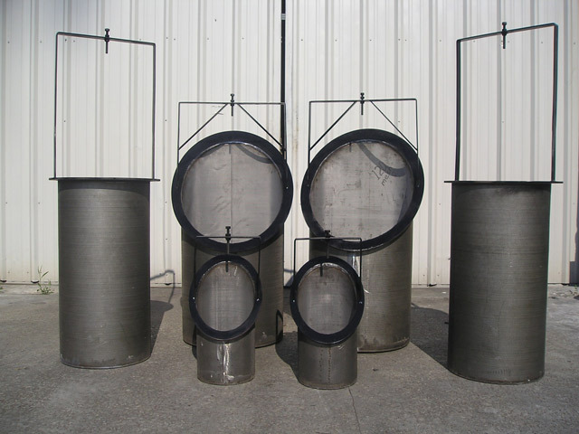 Oil basket strainers in various sizes displayed against a metal backdrop, showcasing their cylindrical design and mesh filtering capability for efficient oil filtration.